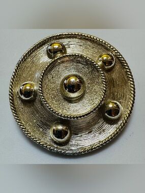 BSK silver tone circle brooch